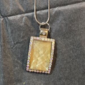Kelly Charveaux Gold-Toned Pendant With Silver Necklace